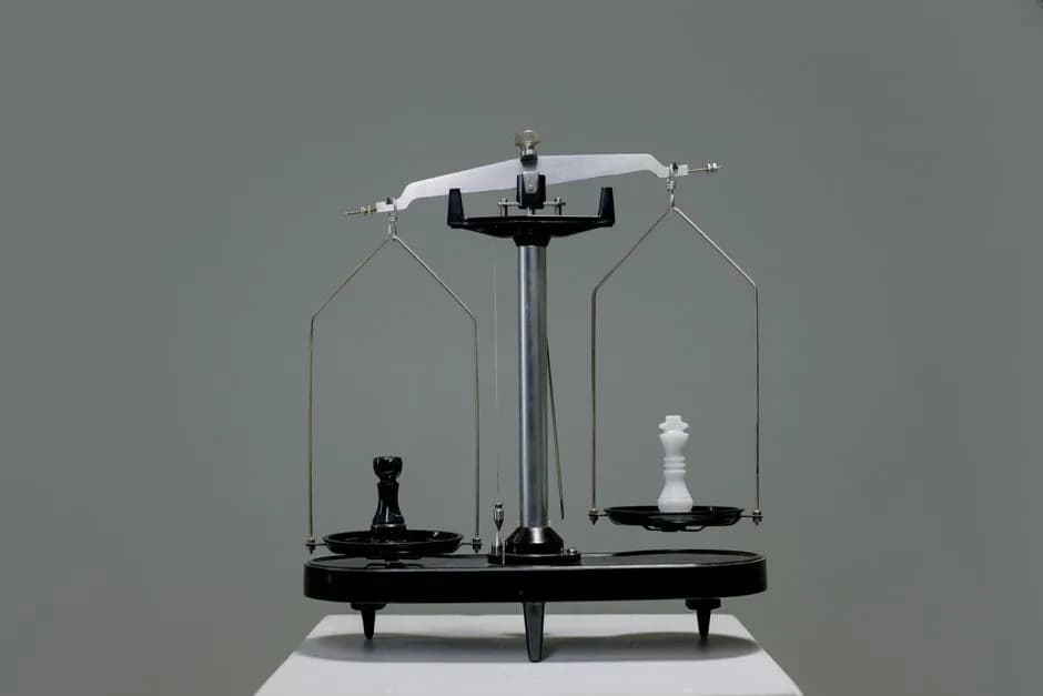 Chess pieces balanced on a scale depicting strategy in decision making