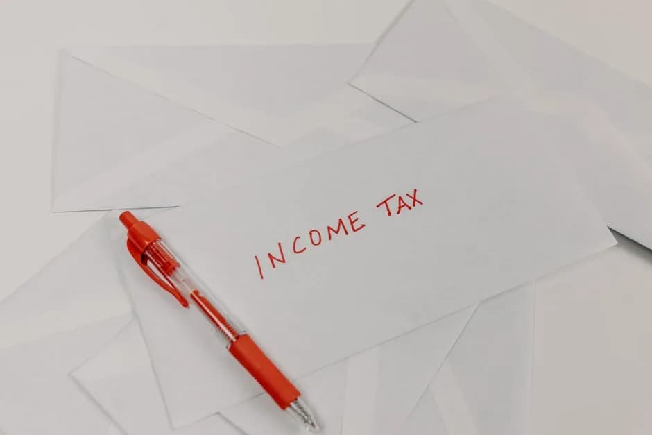 Income tax envelope with red pen for tax filing preparation
