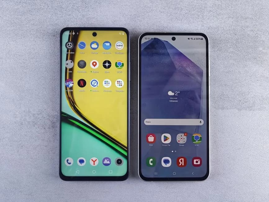 Two smartphones side by side for gaming app comparison