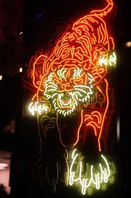 Bright neon tiger signage glowing at night