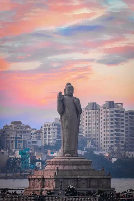 Buddha statue at Hussain Sagar Lake Hyderabad Telangana India at sunset with city skyline