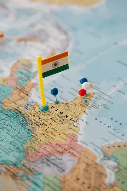India map close-up with a flag and pushpins