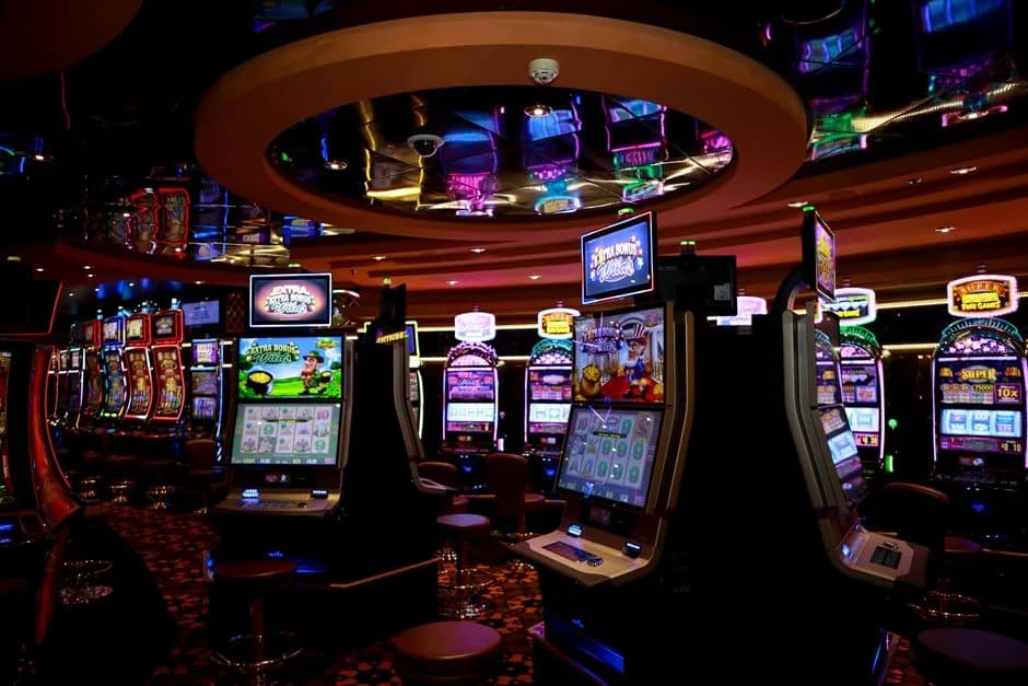Vibrant casino floor with colorful slot machines and bright lights