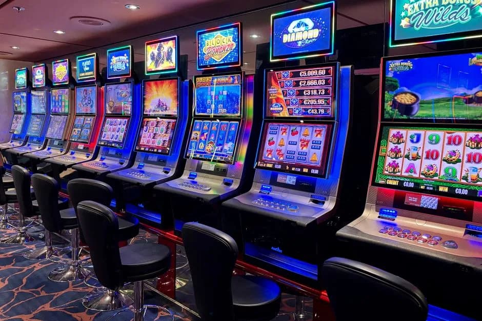 Bright casino slot machines with colorful digital displays