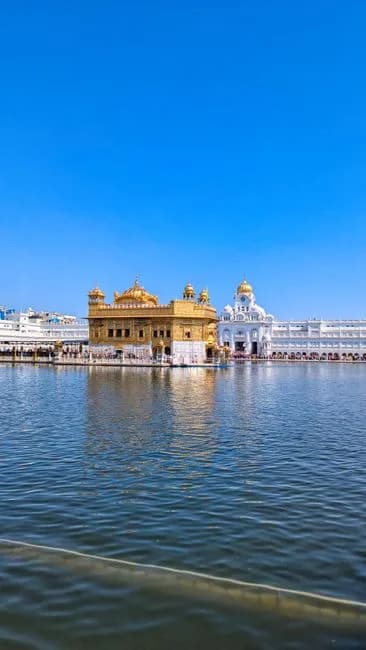 Golden Temple reflected in sacred pool Amritsar Punjab India