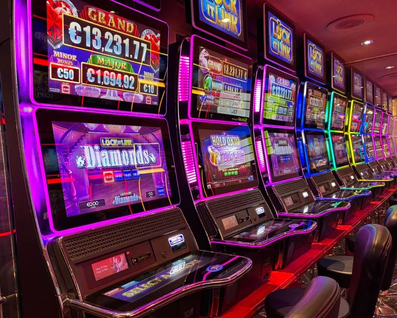Colorful illuminated slot machines with neon lights in a casino