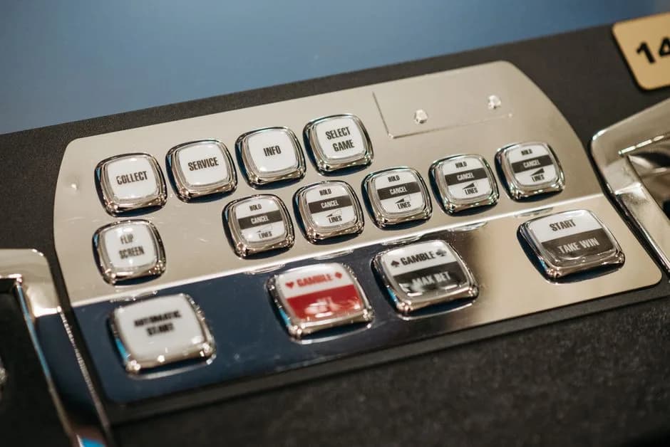 Detailed view of a casino slot machine's control panel and info display
